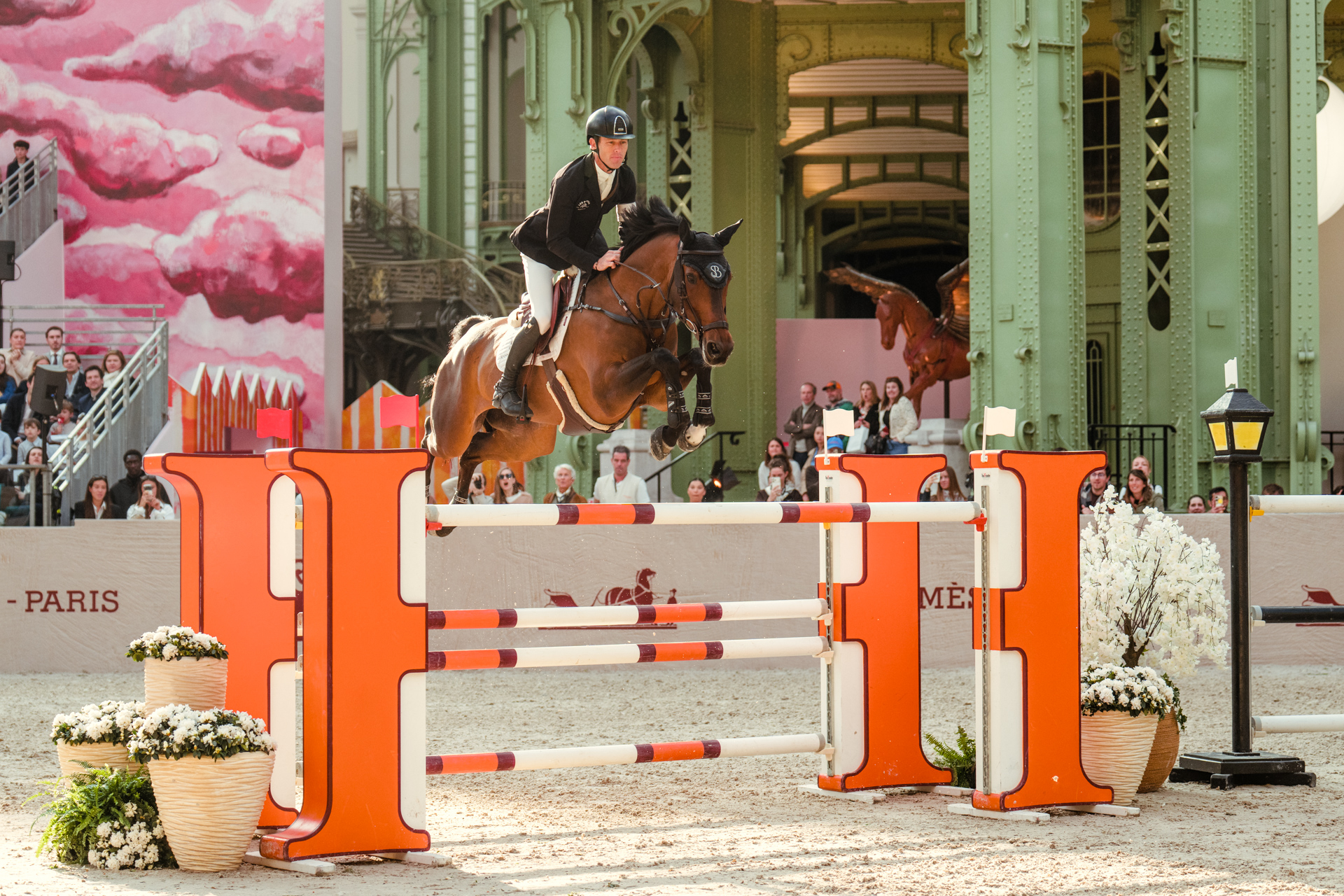Scott Brash on Hello Chadora Lady clearing a fence at the Grand Prix Hermès